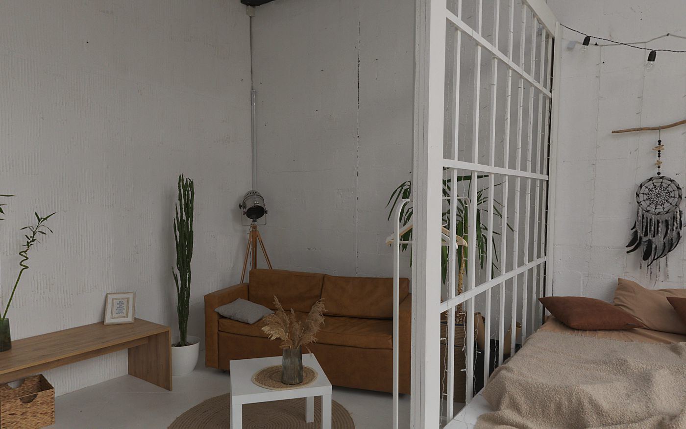 Loft bedroom with tall windows